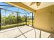 Screened patio offers an outdoor living space with view of the landscaped backyard at 324 Casalino Dr, Nokomis, FL 34275