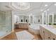 Luxurious bathroom with a soaking tub, walk-in shower, double vanity and octagon ceiling at 35 Watergate Dr # 1402, Sarasota, FL 34236