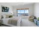 Well-lit bedroom with sliding glass doors to a private balcony and great outdoor views at 35 Watergate Dr # 1402, Sarasota, FL 34236