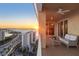 Relaxing balcony showcasing stunning sunset views over the water and cityscape at 35 Watergate Dr # 1402, Sarasota, FL 34236
