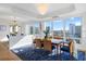 Bright dining area boasts city views, modern lighting, and access to an open living space at 35 Watergate Dr # 1402, Sarasota, FL 34236