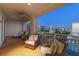 Expansive balcony providing multiple seating areas and city views at 35 Watergate Dr # 1402, Sarasota, FL 34236