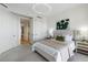 Cozy bedroom featuring plush carpeting, a comfortable bed, and ample closet space at 35 Watergate Dr # 1402, Sarasota, FL 34236