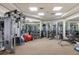Fully-equipped gym with free weights, weight machines and mirrored walls, offering a complete fitness experience at 35 Watergate Dr # 1402, Sarasota, FL 34236
