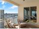 Comfortable seating, city and waterfront views, and access to the living area make this a great balcony at 35 Watergate Dr # 1402, Sarasota, FL 34236