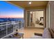 Picturesque balcony with views of the bridge and sliding glass doors to the bedroom at 35 Watergate Dr # 1402, Sarasota, FL 34236