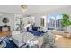 Sun-filled living room features contemporary design, hardwood floors, and floor-to-ceiling windows at 35 Watergate Dr # 1402, Sarasota, FL 34236