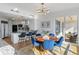 Bright kitchen and dining area with hardwood floors, marble countertops, and balcony access at 35 Watergate Dr # 1402, Sarasota, FL 34236