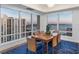 Bright dining room with seating for six offering panoramic city and waterfront views at 35 Watergate Dr # 1402, Sarasota, FL 34236