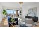 Bright living room features elegant décor, hardwood floors, and expansive windows with scenic views at 35 Watergate Dr # 1402, Sarasota, FL 34236
