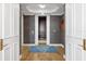 View of an open elevator with wood-paneled walls, lighting, and flooring at 35 Watergate Dr # 1402, Sarasota, FL 34236