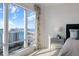This bedroom offers stunning waterfront views from its floor-to-ceiling windows at 35 Watergate Dr # 1402, Sarasota, FL 34236