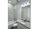 Bathroom features a tub, granite-topped vanity and gray-veined marble style at 3525 Mcintosh Rd, Sarasota, FL 34232
