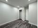 An empty bedroom featuring modern wood floors, closet, and neutral colors at 3525 Mcintosh Rd, Sarasota, FL 34232