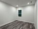 An empty bedroom with recessed lighting and wood floors at 3525 Mcintosh Rd, Sarasota, FL 34232