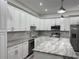 Close up of kitchen island with stainless appliances and plenty of cabinet space at 3525 Mcintosh Rd, Sarasota, FL 34232