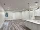 An open-concept view from the kitchen into a large living room area at 3525 Mcintosh Rd, Sarasota, FL 34232