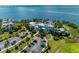Aerial view of a bayfront community with a parking lot, lush landscaping, and waterfront views at 384 Aruba Cir # 103, Bradenton, FL 34209