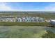 Aerial view of the condo complex surrounded by lush greenery and waterfront, showcasing the serene location at 384 Aruba Cir # 103, Bradenton, FL 34209