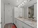 Modern bathroom features double vanity and granite countertops at 384 Aruba Cir # 103, Bradenton, FL 34209