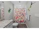 Bathroom featuring a toilet, vanity, and a shower with a colorful patterned curtain at 384 Aruba Cir # 103, Bradenton, FL 34209