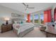 Cozy bedroom featuring a comfortable bed, bright windows with scenic views, and stylish coastal-themed decor at 384 Aruba Cir # 103, Bradenton, FL 34209