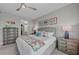 Comfortable bedroom with coastal decor, walk-in closet, and calming colors at 384 Aruba Cir # 103, Bradenton, FL 34209