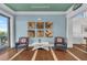 Welcoming entryway featuring coastal-themed decor, comfortable seating, and views to the exterior at 384 Aruba Cir # 103, Bradenton, FL 34209