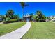 Charming home with a well-manicured front yard and inviting walkway at 384 Aruba Cir # 103, Bradenton, FL 34209
