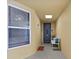 Cozy hallway with beach themed decor and front door at 384 Aruba Cir # 103, Bradenton, FL 34209