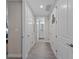 Hallway leading to a bathroom with multiple doors and neutral-toned walls at 384 Aruba Cir # 103, Bradenton, FL 34209