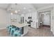 Spacious kitchen with white cabinets, stainless steel appliances, and large island with seating at 384 Aruba Cir # 103, Bradenton, FL 34209