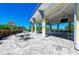 Outdoor patio seating area with tables, chairs, bar access, and waterfront views at 384 Aruba Cir # 103, Bradenton, FL 34209