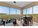 Relax on the screened patio with comfortable seating and a ceiling fan, offering stunning water views at 384 Aruba Cir # 103, Bradenton, FL 34209