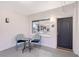 Welcoming entryway with an outdoor table, chairs and a view into the kitchen at 400 Golden Gate Pt # 51 & 52, Sarasota, FL 34236