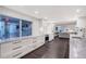Modern kitchen featuring white cabinetry, sleek countertops, and stainless steel appliances at 400 Golden Gate Pt # 51 & 52, Sarasota, FL 34236