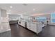 Gourmet kitchen featuring sleek white cabinets, granite countertops, stainless steel appliances, and gorgeous water views at 400 Golden Gate Pt # 51 & 52, Sarasota, FL 34236