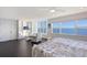 Light-filled main bedroom with a built-in bookcase and stunning water views at 400 Golden Gate Pt # 51 & 52, Sarasota, FL 34236