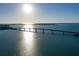 Gorgeous view of a bridge spanning across a beautiful body of water during a stunning sunset at 400 Golden Gate Pt # 51 & 52, Sarasota, FL 34236