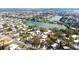 Serene aerial view showcases a lakeside community with mature trees and well-maintained homes at 411 S Oxford Dr # 411, Nokomis, FL 34275