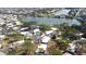 Aerial view of homes nestled on lush grounds near a tranquil lake at 411 S Oxford Dr # 411, Nokomis, FL 34275