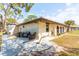Beautiful backyard patio with outdoor seating and well manicured landscaping, perfect for relaxation at 411 S Oxford Dr # 411, Nokomis, FL 34275
