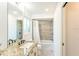 Bathroom features granite countertops, a bathtub/shower combo and modern fixtures at 411 S Oxford Dr # 411, Nokomis, FL 34275