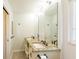 Bathroom features granite countertops, double sinks, modern fixtures, and ample lighting at 411 S Oxford Dr # 411, Nokomis, FL 34275