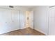 Neutral bedroom featuring wood floors, white walls and double door closets at 411 S Oxford Dr # 411, Nokomis, FL 34275