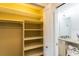 Bright closet with built-in shelving and clothing rod is conveniently located near the bathroom at 411 S Oxford Dr # 411, Nokomis, FL 34275