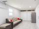 Spacious garage with stainless steel refrigerator, seating area and ample storage at 411 S Oxford Dr # 411, Nokomis, FL 34275