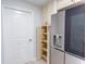 A kitchen view showcasing stainless steel refrigerator and pantry at 411 S Oxford Dr # 411, Nokomis, FL 34275