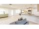 Bright living space with open kitchen island, natural light, and seamless flow between rooms at 411 S Oxford Dr # 411, Nokomis, FL 34275