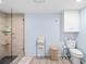 Bathroom featuring walk-in shower with glass door, toilet, and towels at 4320 Bent Tree Blvd, Sarasota, FL 34241